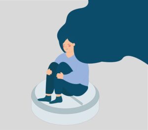 woman sits on medication